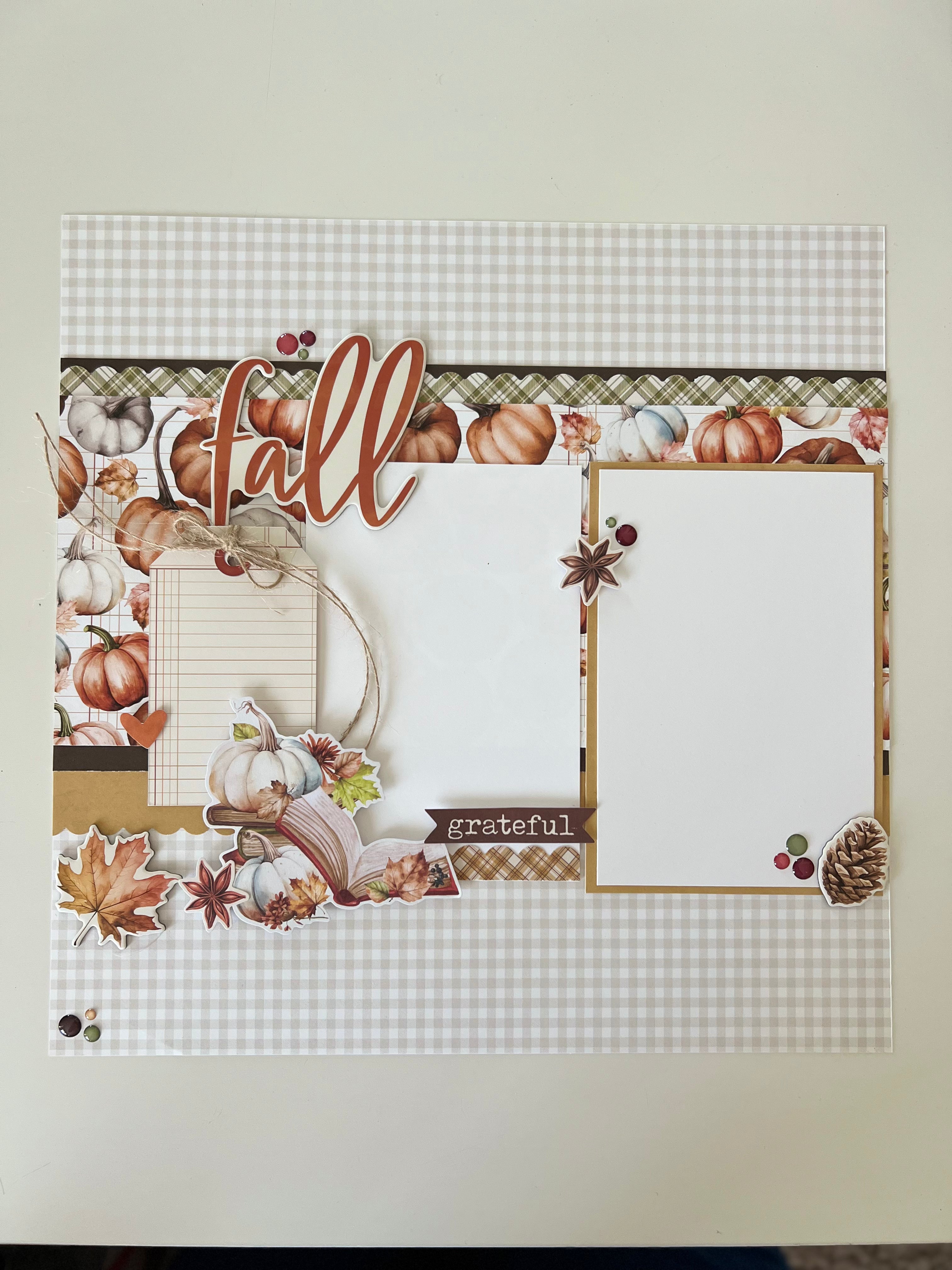 Decorative paper with 'fall' and 'grateful' text, pumpkins, and leaves on a checkered background.